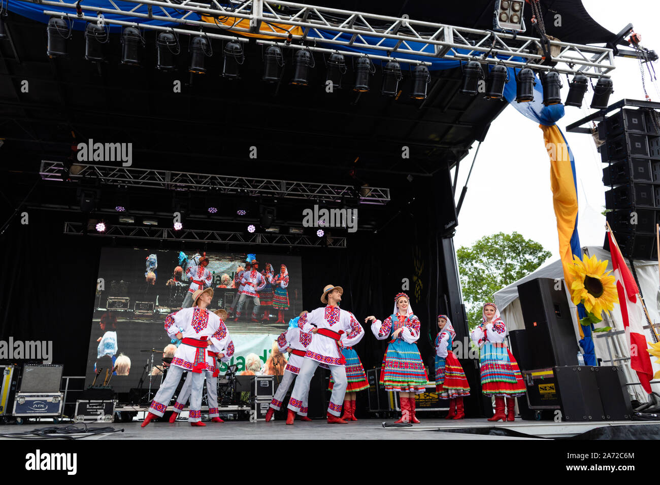 Ukrainian youth people in national costumes take part in the Montreal Ukrainian Festival. Artistic groups of dancers from Ukraine and Canada present a Stock Photo