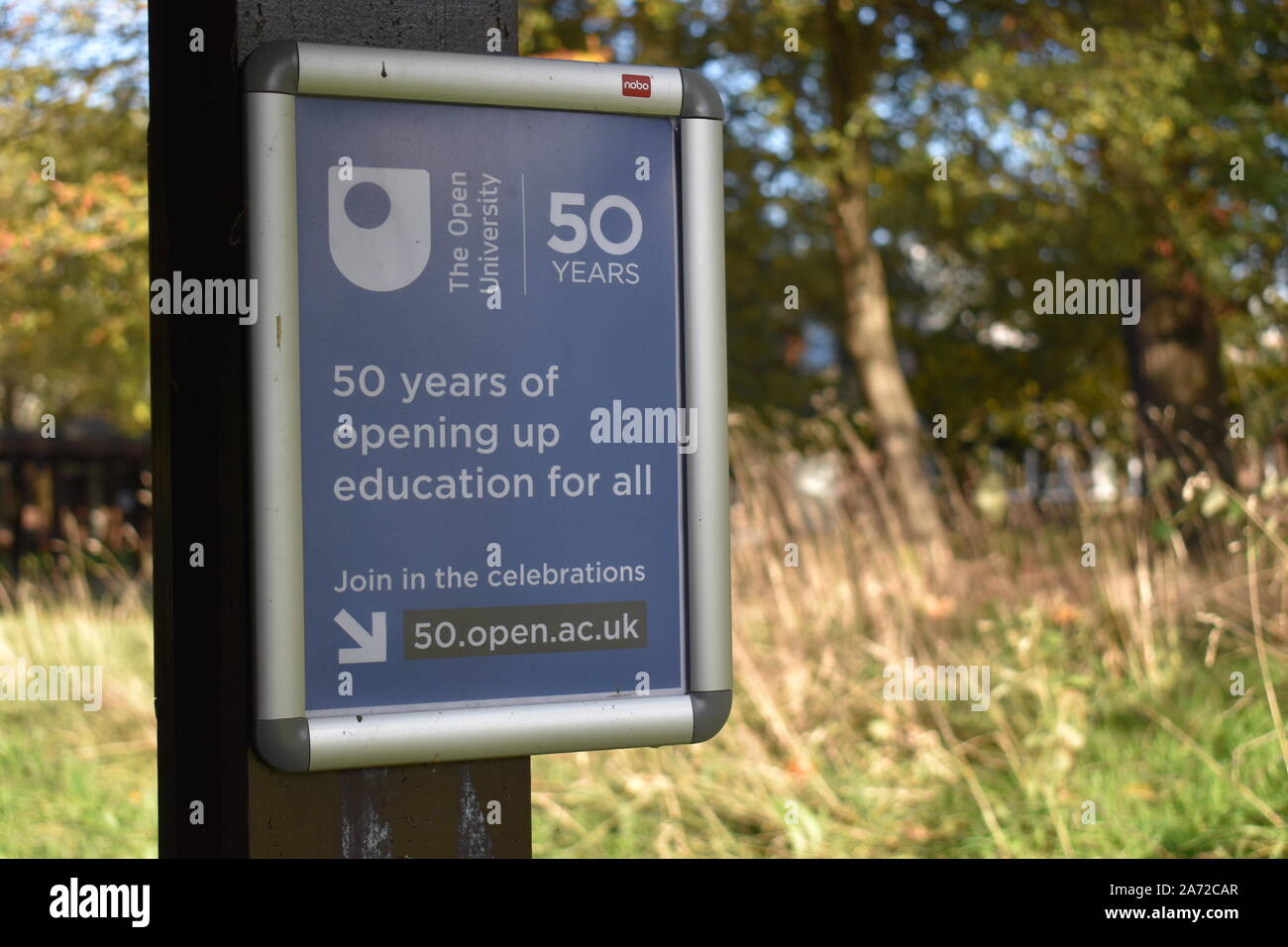 Sign celebrating 50 years of the Open University Stock Photo