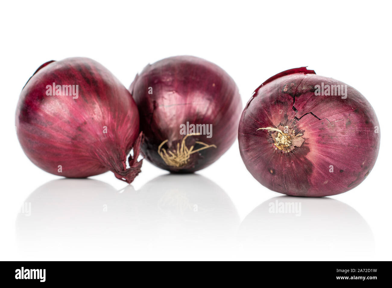 Group of three whole tasty onion red isolated on white background Stock Photo