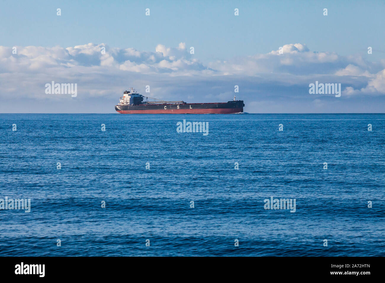 A large ship in the Strait of Juan De Fuca seen from Dungeness Recreation Area, Washington. Stock Photo
