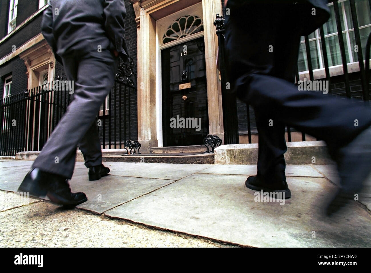 Depersonalised shot of two people walking to number 10 Downing St, London, the Primeminister's residence Stock Photo