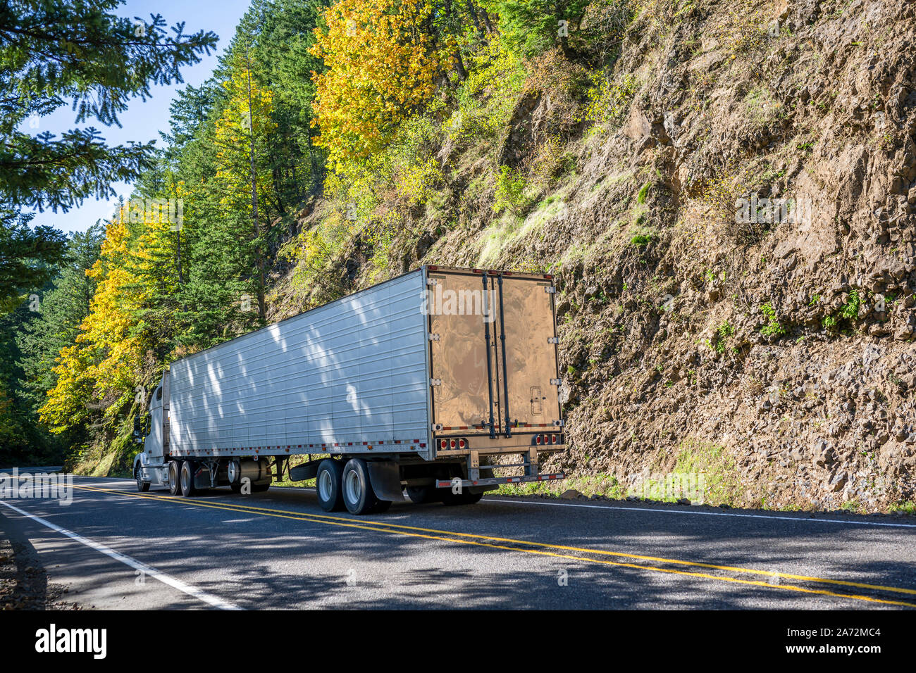 Big rig classic blue pro American semi truck with vertical