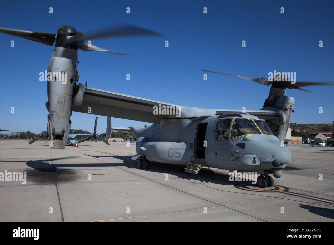 U.S. Marines taxii an MV-22B Osprey into position on Marine Corps Air Station Camp Pendleton, California, Oct. 28, 2019. The air station provides the 1st Marine Expeditionary Force and 3rd Marine Aircraft Wing with flexible deployment options. (U.S. Marine Corps photo by Lance Cpl. Angela Wilcox) Stock Photo