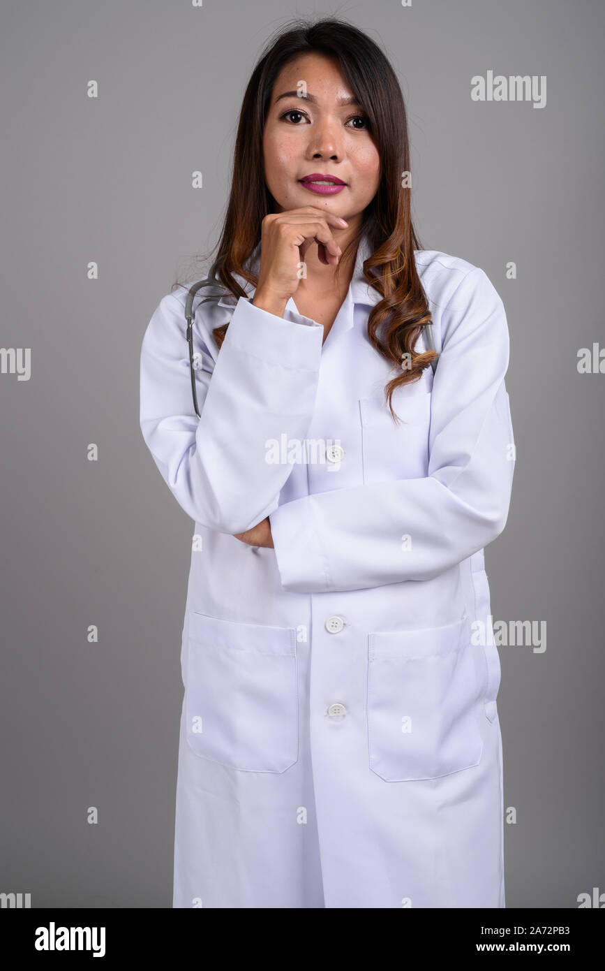 Portrait of Asian woman doctor with wavy hair Stock Photo - Alamy