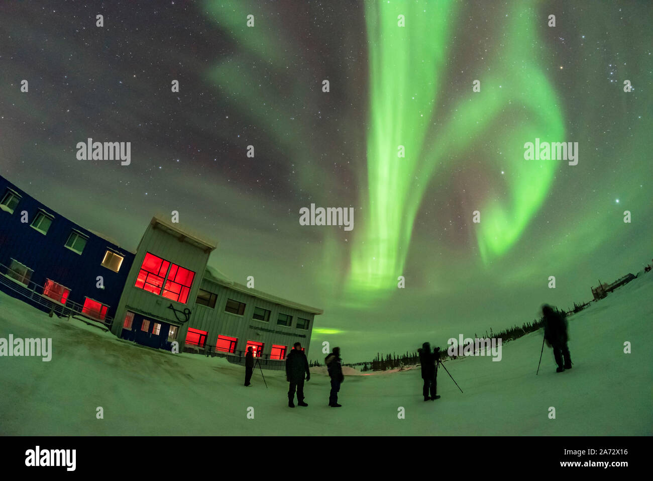 Guests in the Learning Vacations program at the Churchill Northern Studies Centre view the aurora on their first night of the program for 2019 on Janu Stock Photo