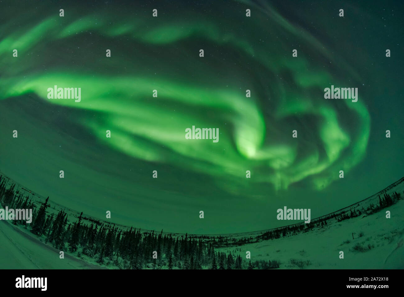 One of a short series of images showing the development of an aurora display from a classic arc into a more complex pattern of concentric arcs and wit Stock Photo