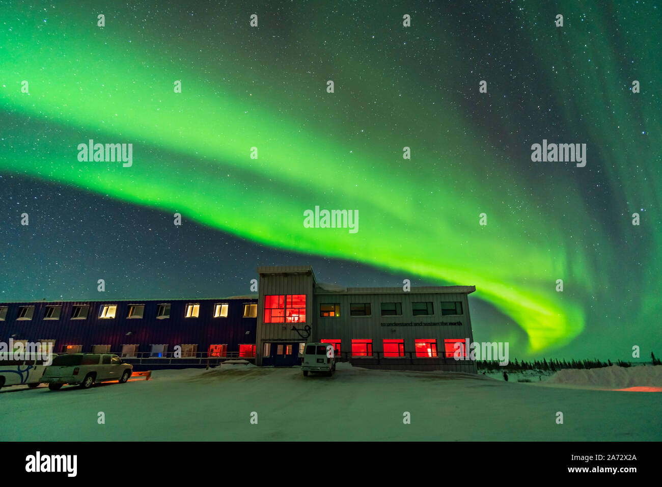 A classic arc of aurora over the Northern Studies Centre near Churchill, Manitoba, on Feb 8, 2019. This was a night when both our Road Scholar group a Stock Photo