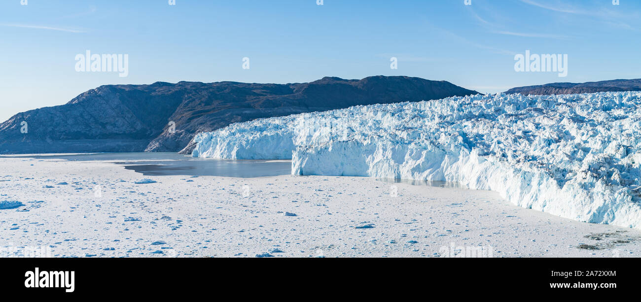 Climate Change and Global Warming. Greenland Glacier front of Eqi glacier in West Greenland AKA Ilulissat and Jakobshavn Glacier. Produces many of Greenlands icebergs. Stock Photo