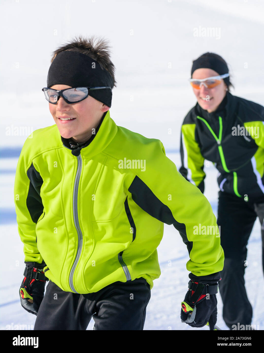 Young experts doing Cross-country skiing Stock Photo