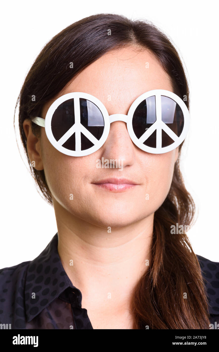 Face of beautiful woman wearing sunglasses with peace sign Stock Photo