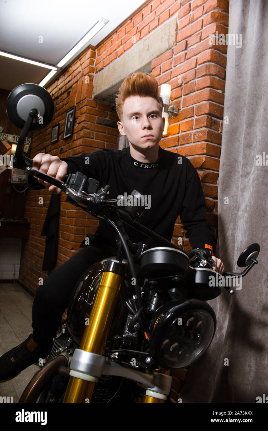 Teenage redhead boy on motorbike, haircuts hairdresser in the Barber shop.  Fashionable stylish retro hairstyle. Portrait of a child with a beautiful h  Stock Photo - Alamy