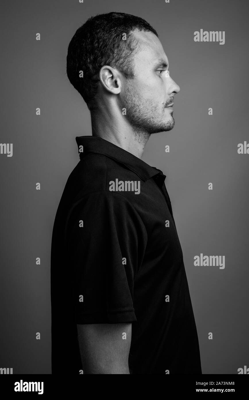 Man white shirt black background Black and White Stock Photos & Images ...