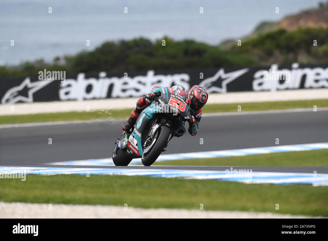 MotoGP Fabio Quartararo powers out of Siberia with the sea in the background on the Yamaha during Warm Up. Stock Photo