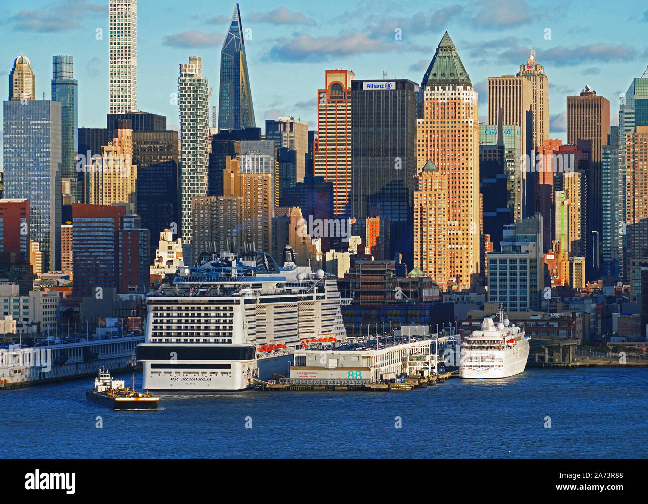 Manhattan Cruise Terminal on west side of mid-town Manhattan with mega ship MSC Meraviglia and mega yacht Silverseas' Silver Wind in port. Stock Photo