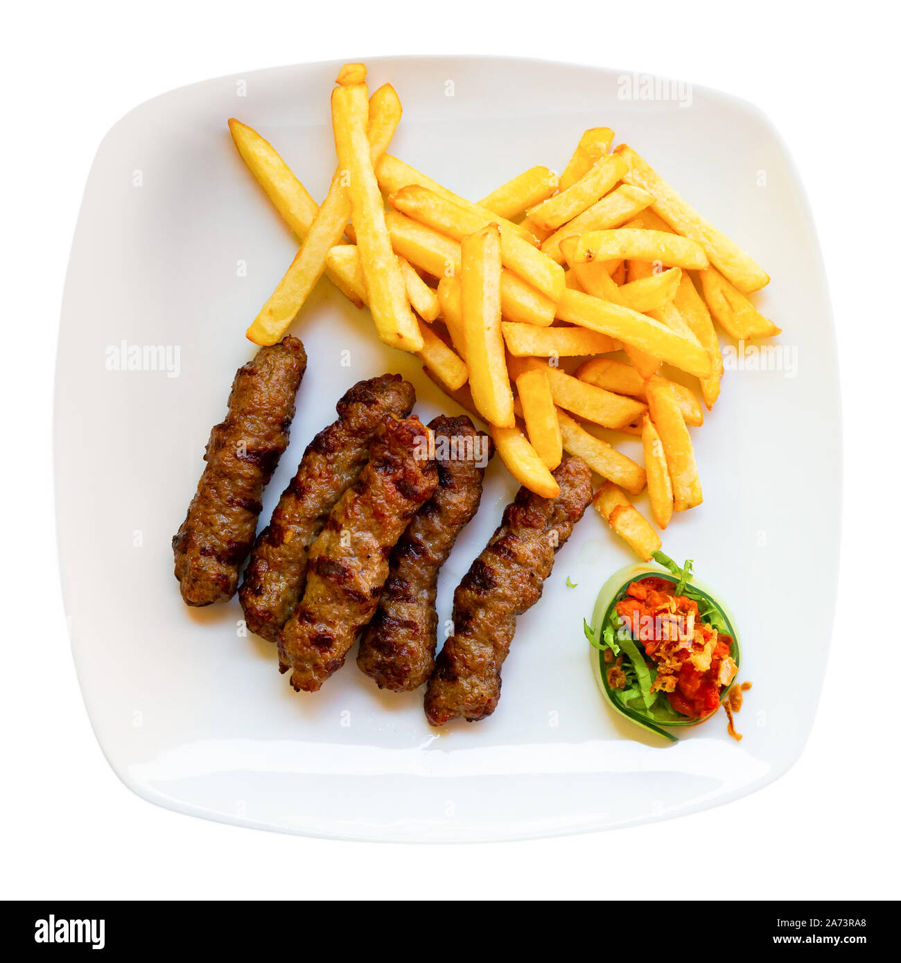 Cevapcici with french fries. Balkan cuisine. Isolated over white background Stock Photo