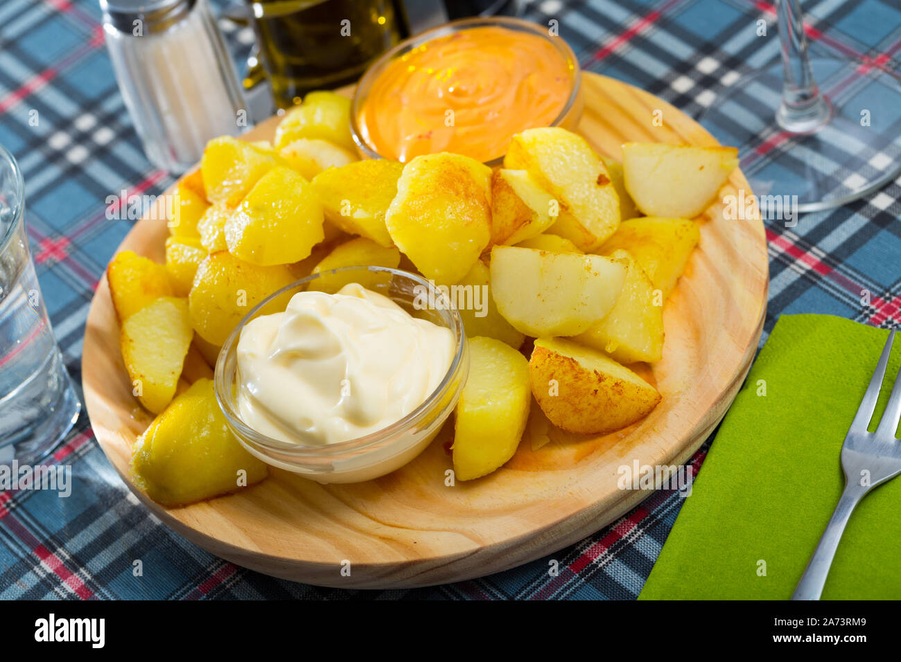 Patatas bravas with garlic mayonnaise and sauce Stock Photo Alamy