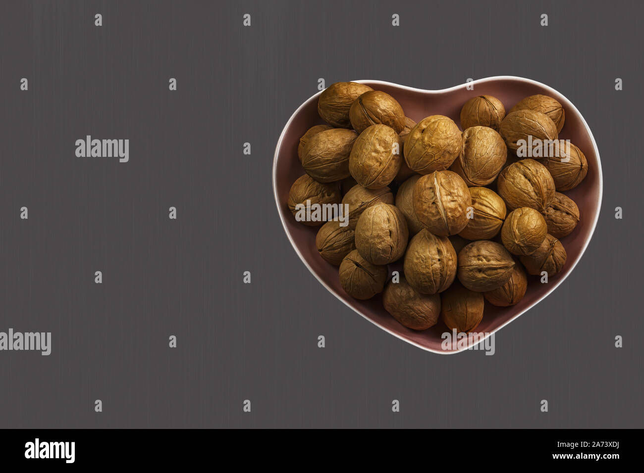 Inshell walnuts, copy spase. Whole ripe walnut, healthy food for the