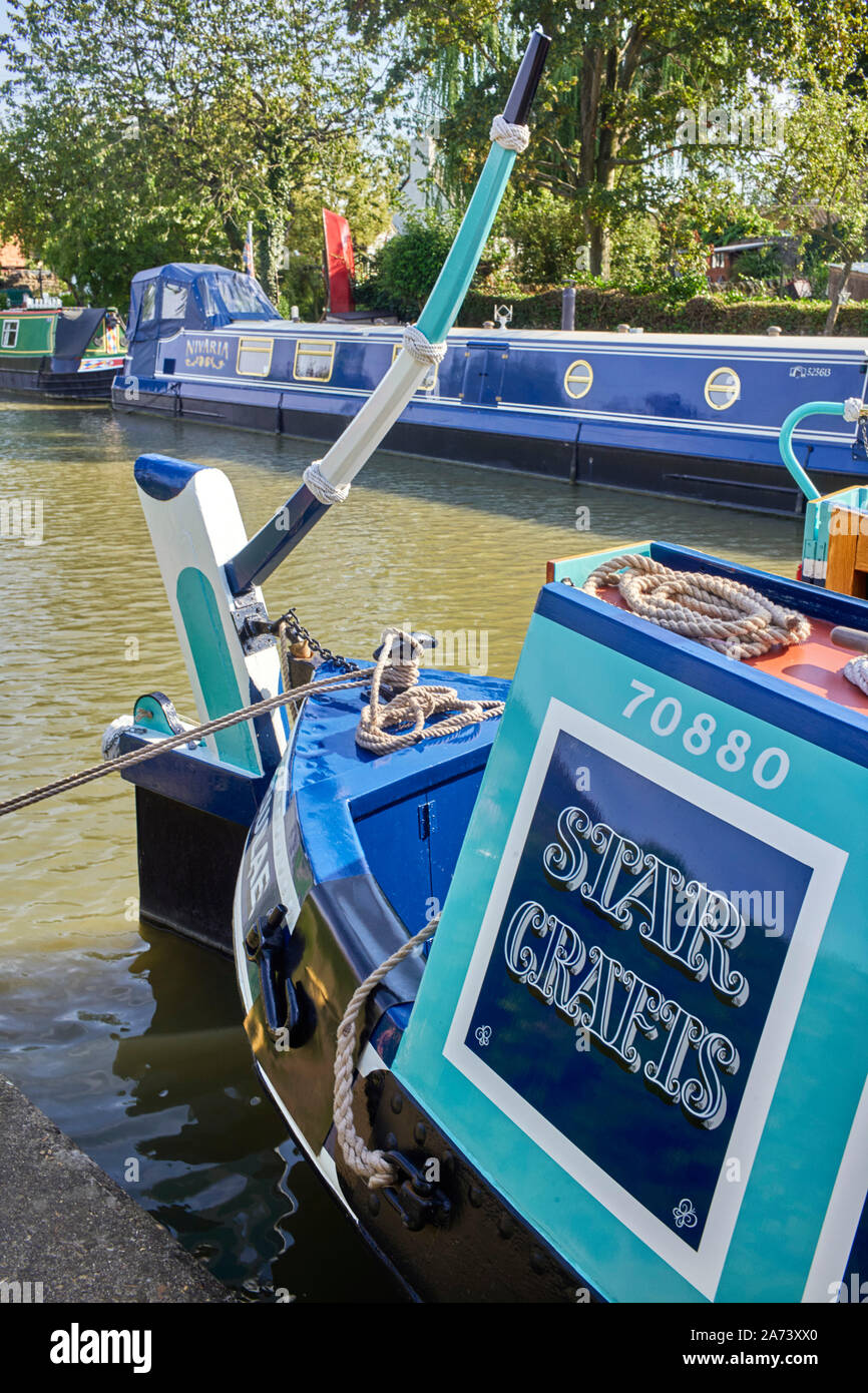 Detail of Star Crafts trading butty on the Grand Union canal showing tiller Stock Photo