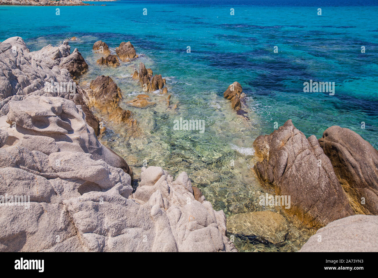 Rocky beach landscape on summer day, Beautiful turquoise color sea water  , Travel holiday destination Greece Stock Photo