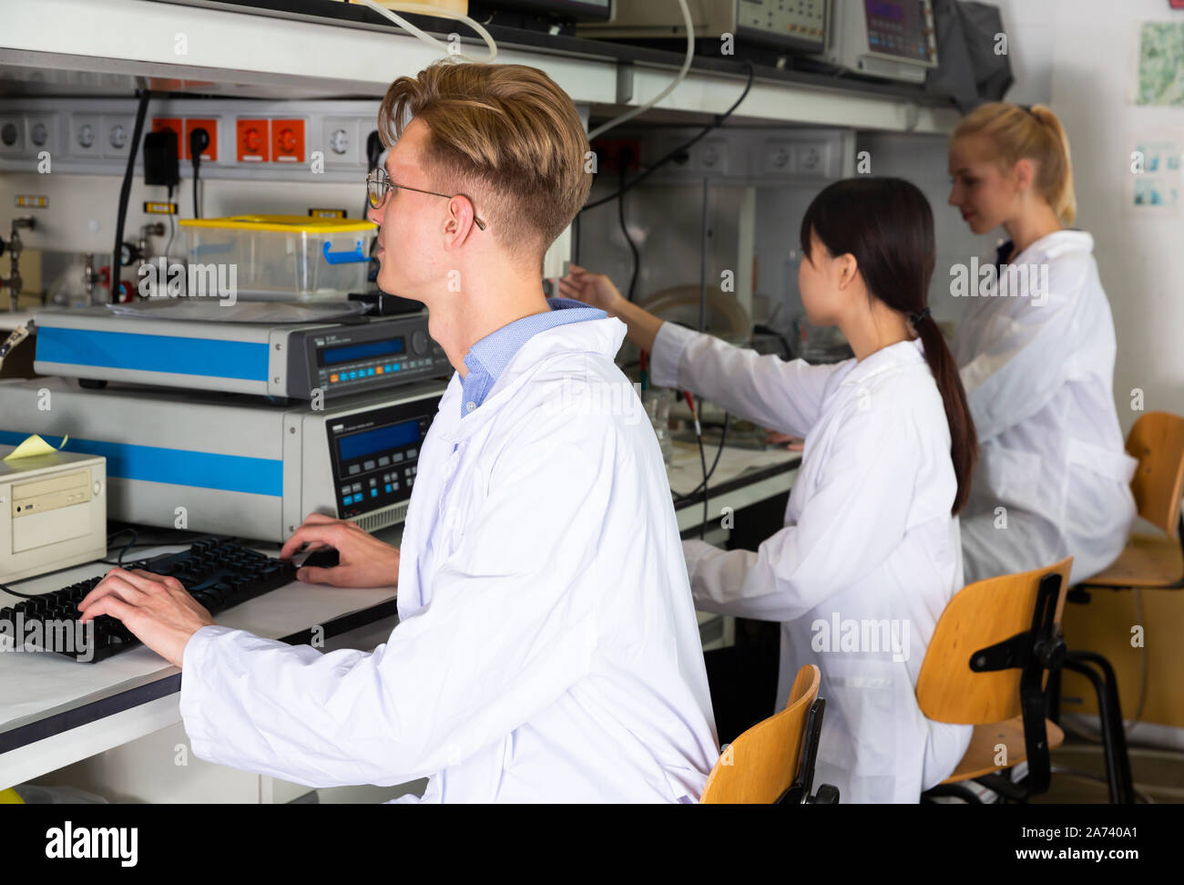 Lab Student Collefe Portrait of intelligent male student working with his coursemates in ...
