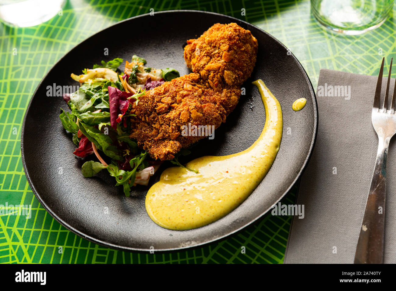 Tandoori chicken in panko bread crumbs served with mix of salads and