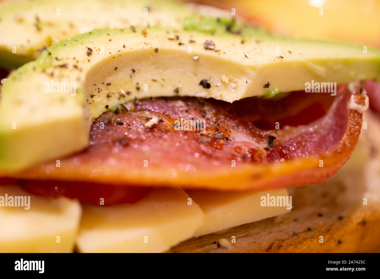 Bacon, avocado, cheese and tomato open sandwich Stock Photo Alamy