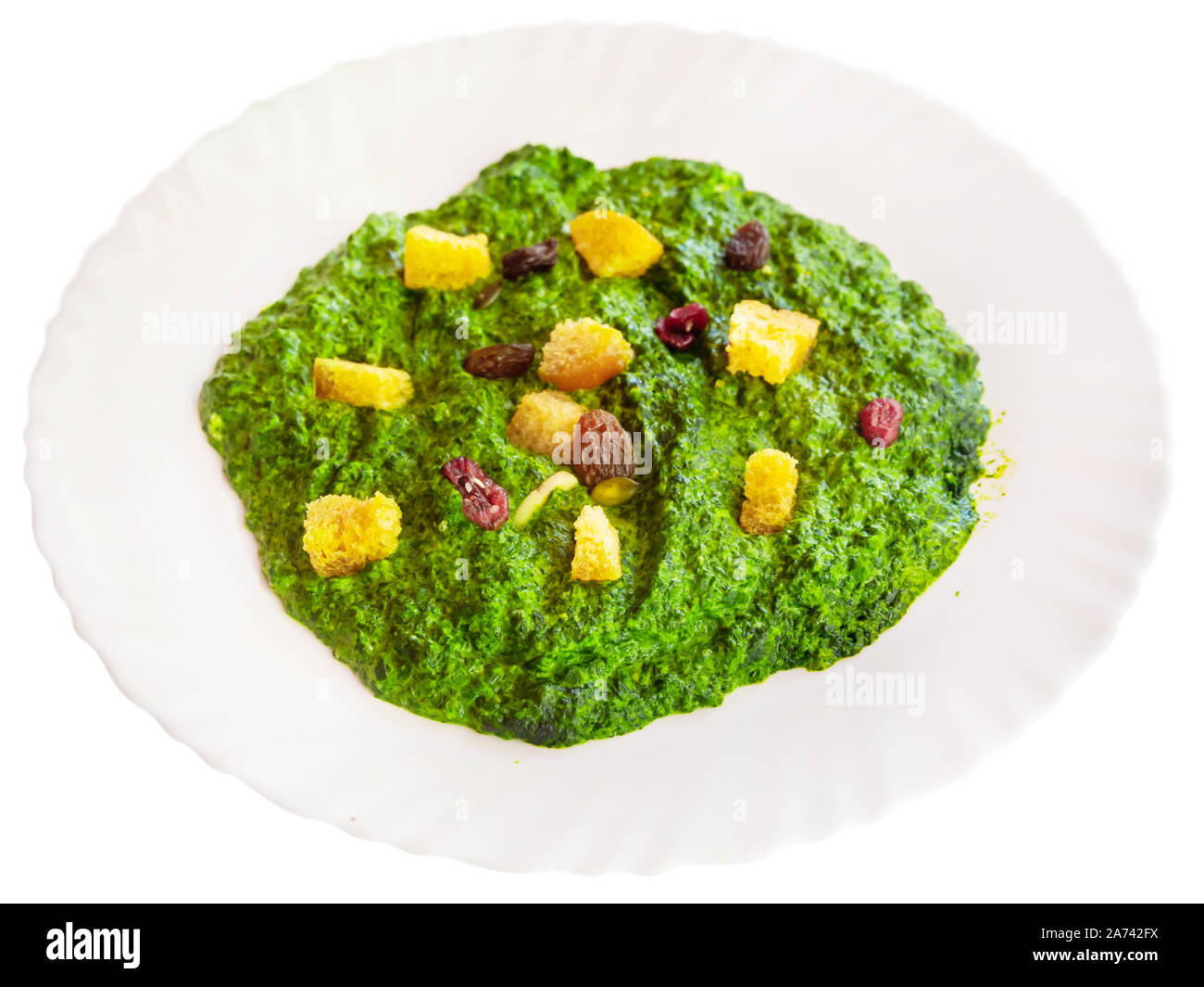 Healthy dinner, spinach gratin served with toasted bread and raisins