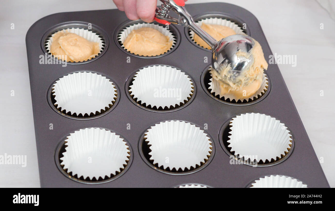 Scooping Cupcake Batter With Dough Scoop Into A Baking Pan With Liners To  Bake American Flag Mini Cupcakes. Stock Photo, Picture and Royalty Free  Image. Image 191046254.