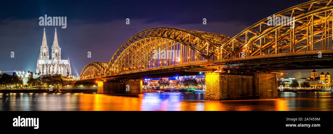 Panorama of Cologne with Cologne Cathedral Hohenzollern bridge and Rhine river at night Stock Photo