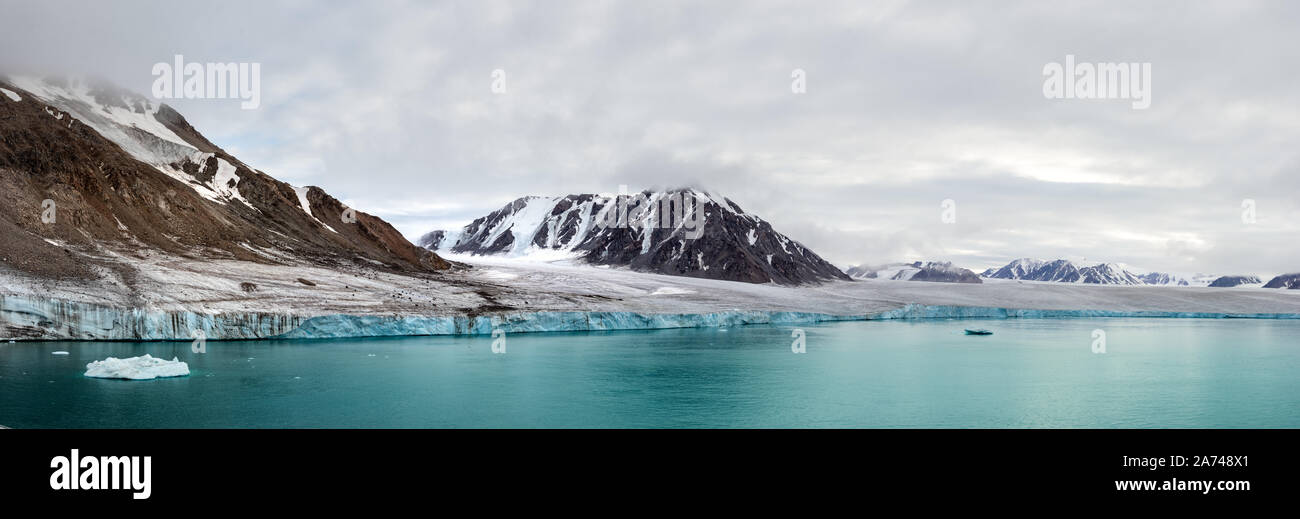 Panorama of a glacier and mountains in Ellesmere Island, part of the Qikiqtaaluk Region in the Canadian territory of Nunavut. Stock Photo