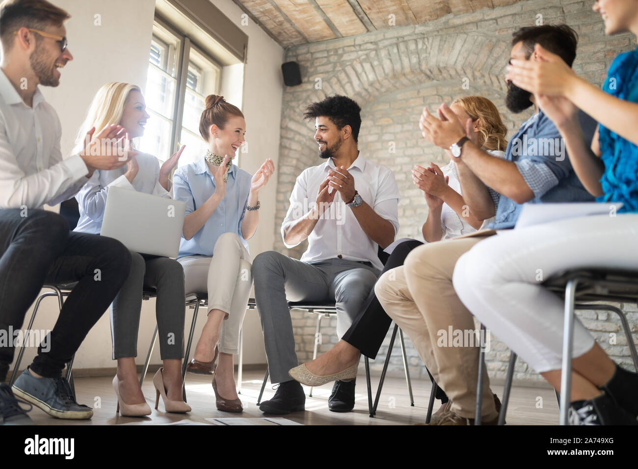 Happy success business team celebrating victory in office Stock Photo ...