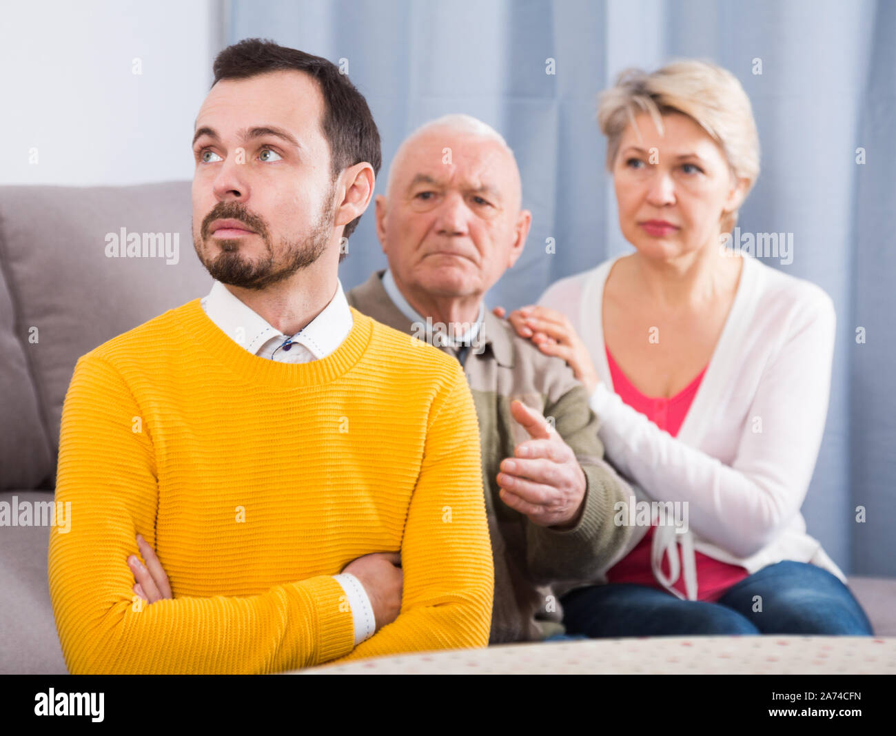 Mother and mature son and tension hi-res stock photography and images ...