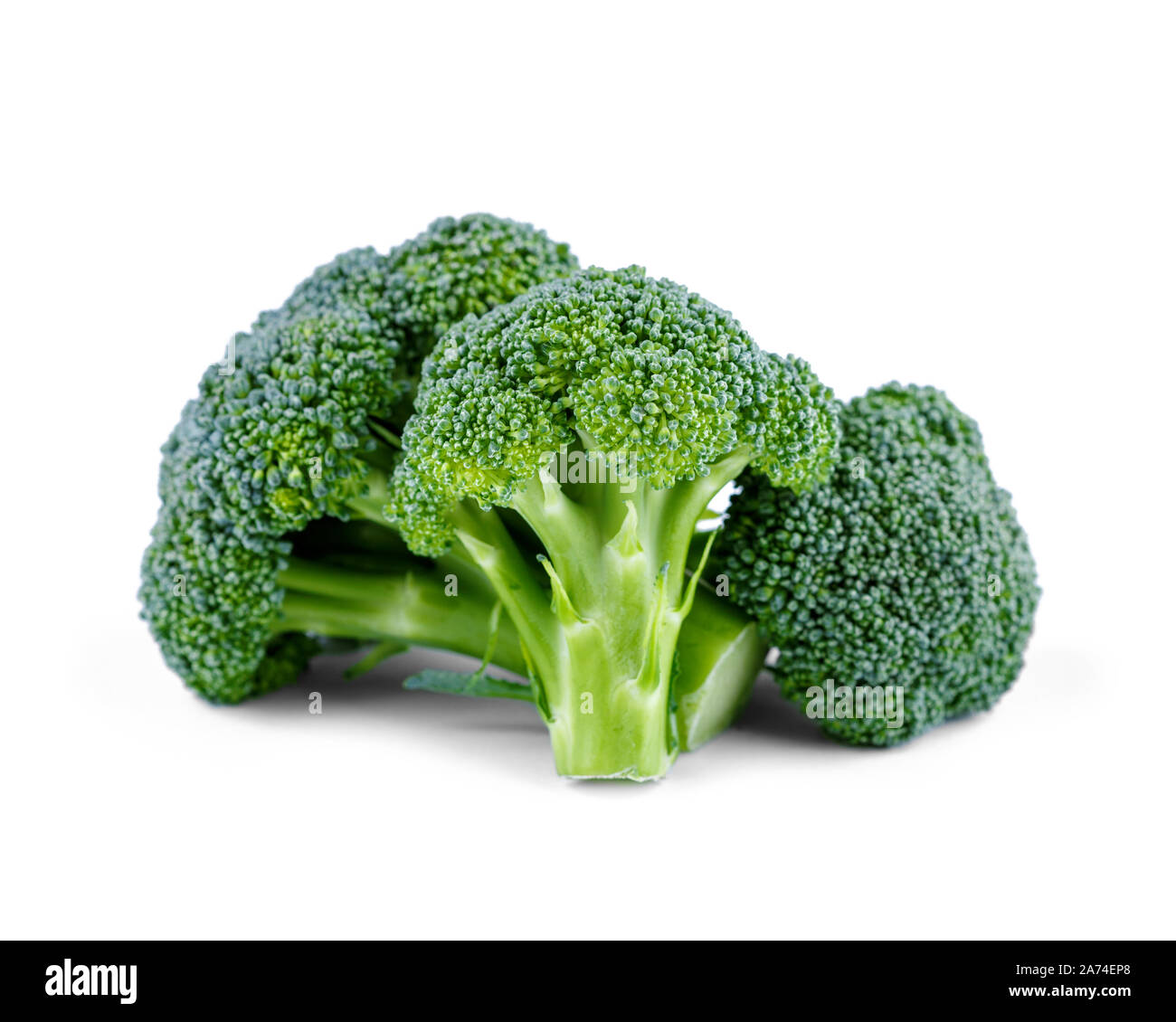 Three green broccoli isolated on white background Stock Photo - Alamy