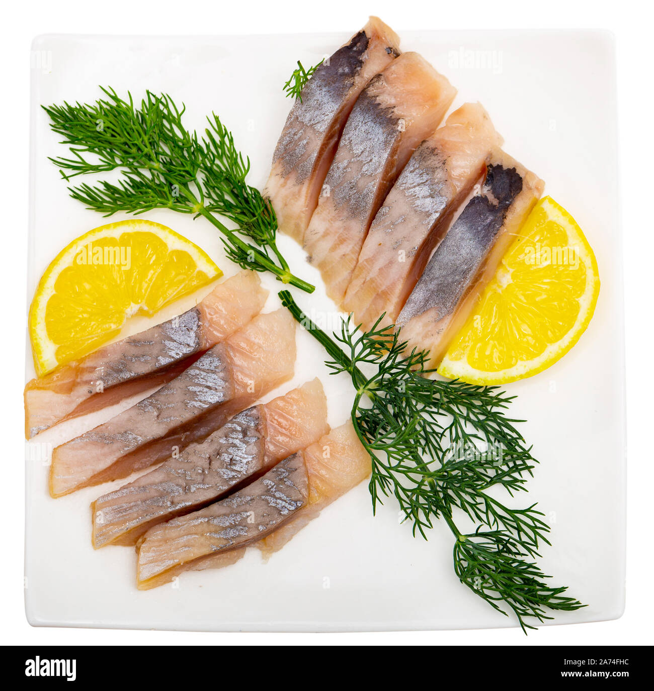 Marinated herring fillet with sliced lemon and dill, healthy food