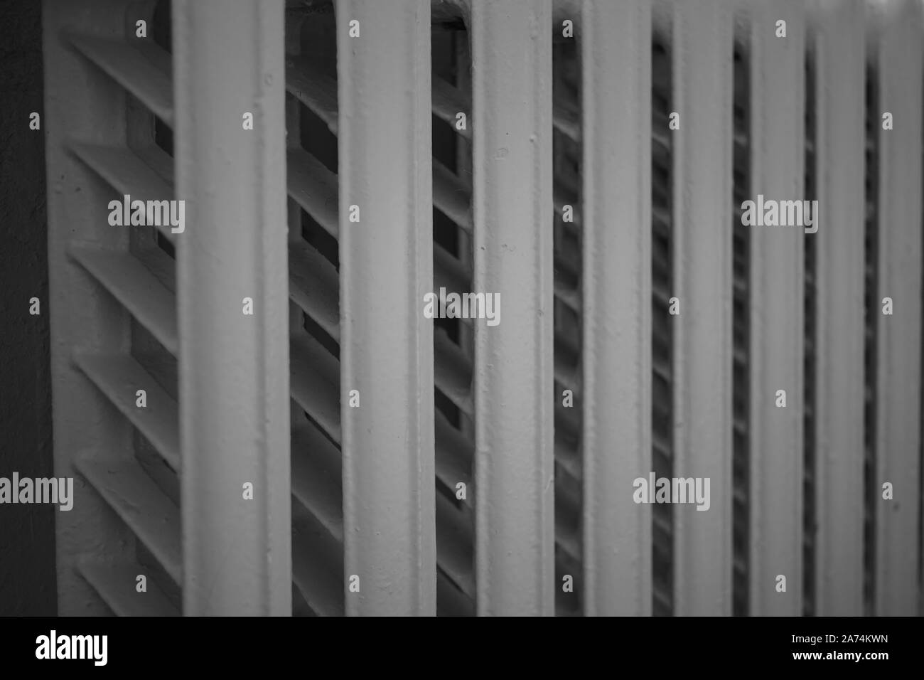 old cast iron radiator, central heating, close-up. Stock Photo