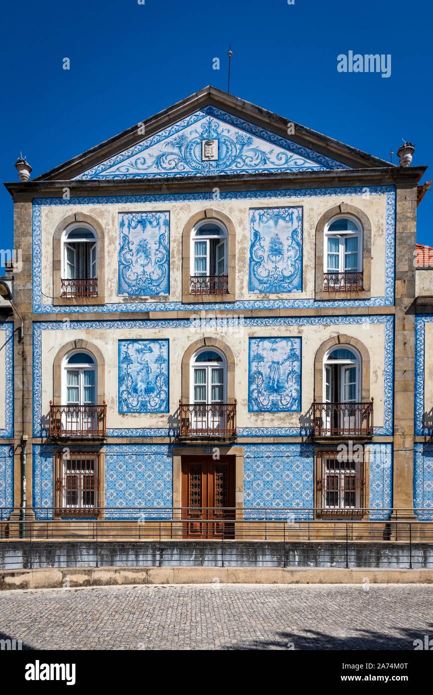 Traditional Portuguese house covered with typical colorful tiles or