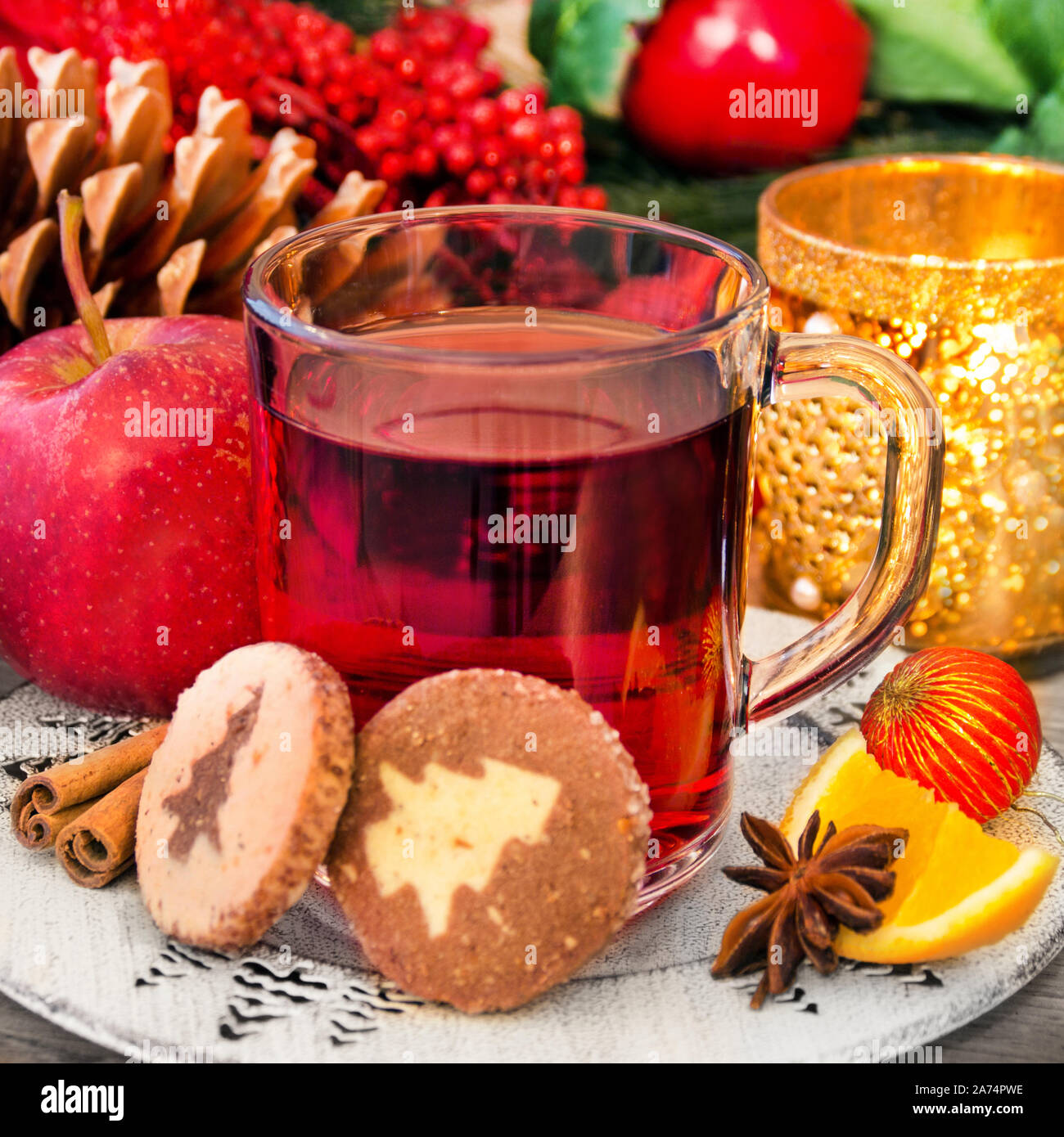 Christmas glow wine with baked biscuits and christmas decoration Stock Photo