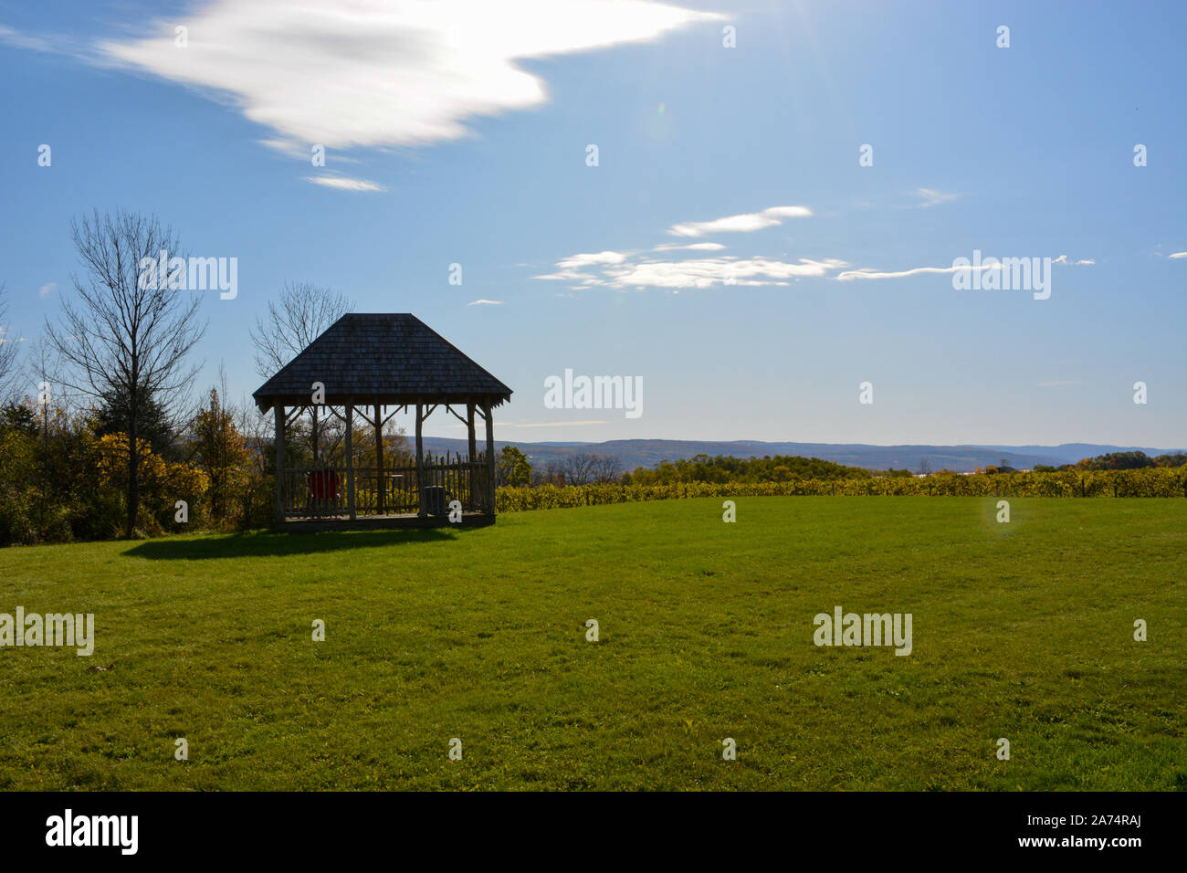 Gazebo on a green lawn with a blue sky Stock Photo - Alamy