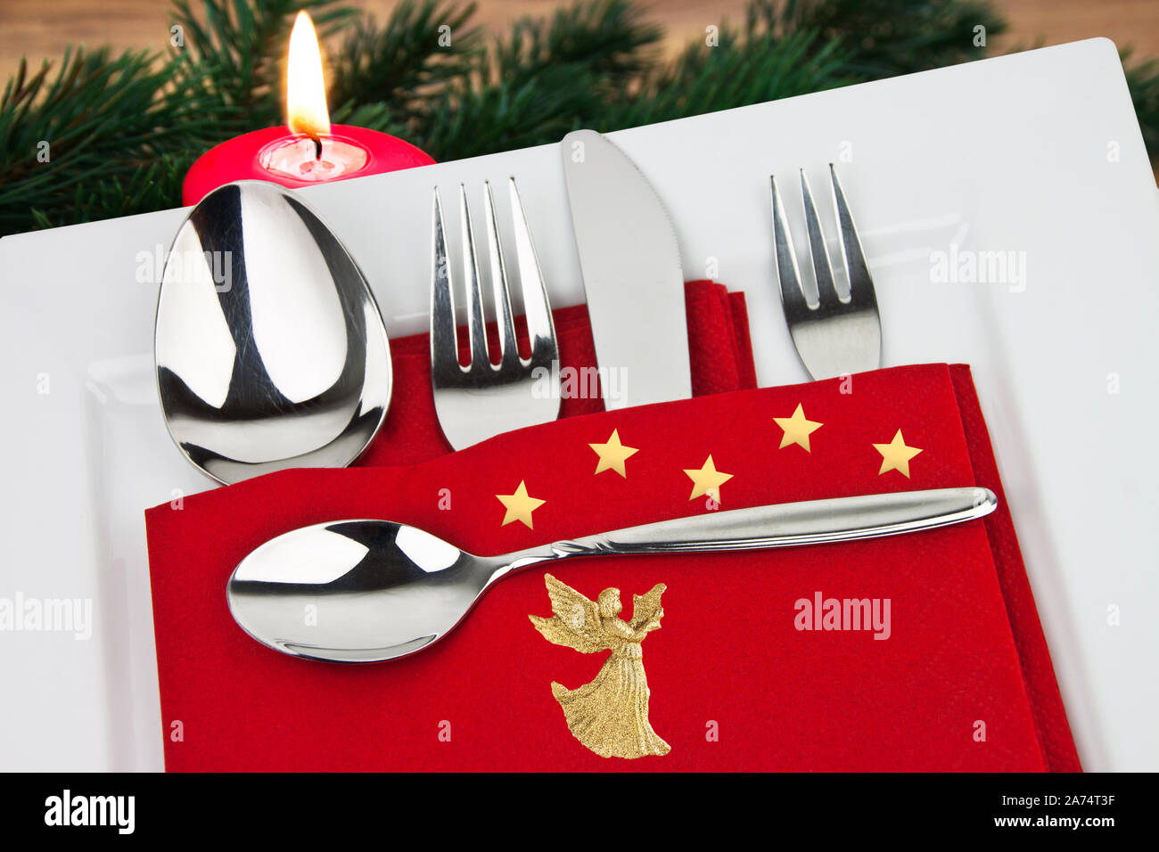 Christmas dinner decoration with stars and angel Stock Photo