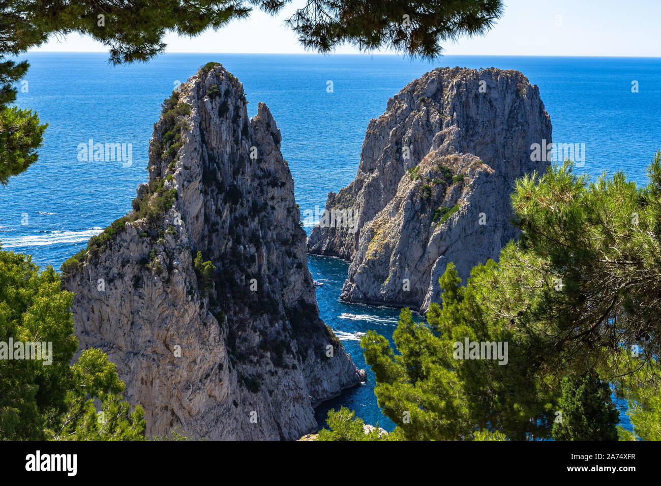 View of Faraglioni, three majestic rocks that emerge from the sea, the most iconic sight of Capri, Italy Stock Photo