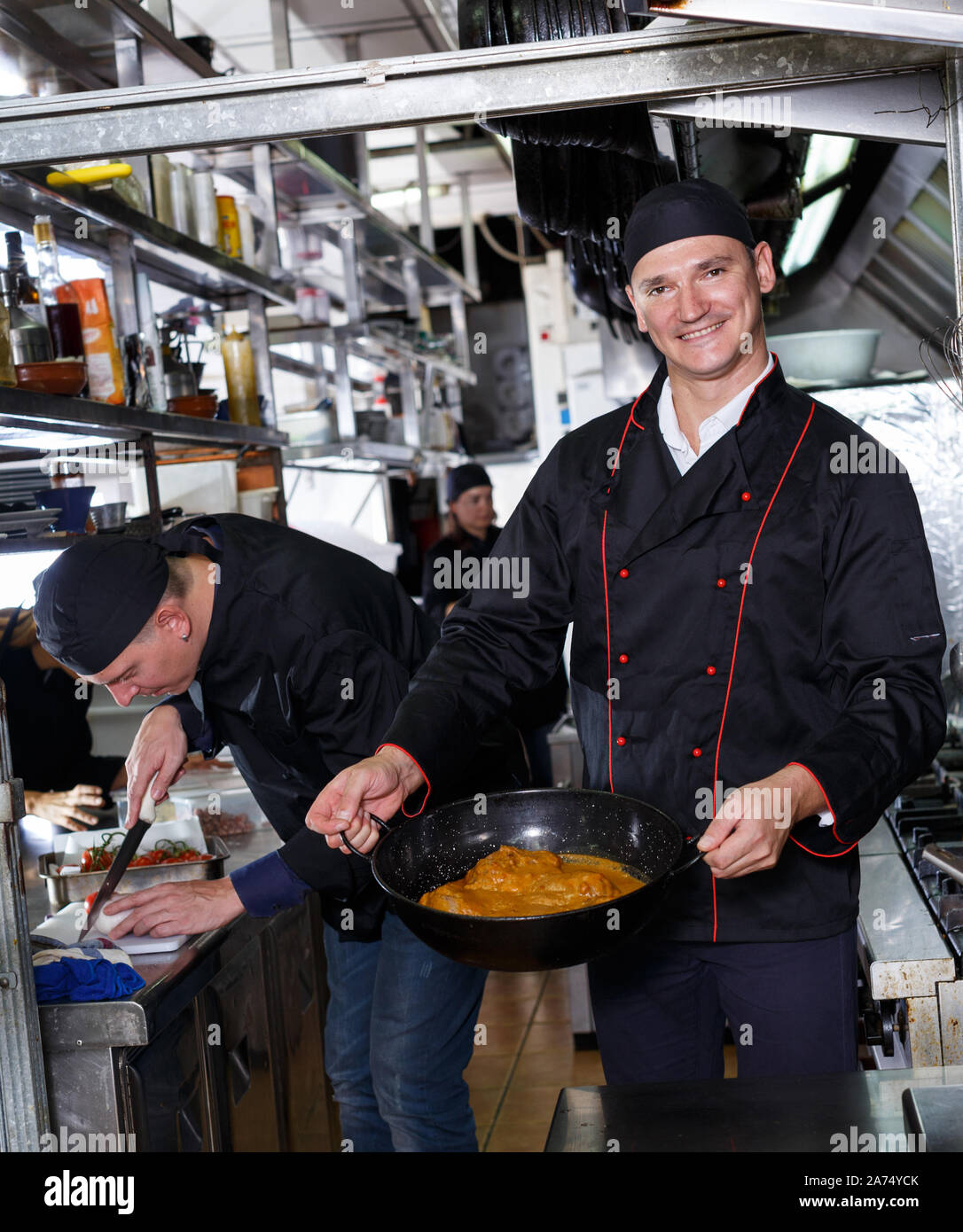 Professional cooks cooking dishes hi-res stock photography and images ...