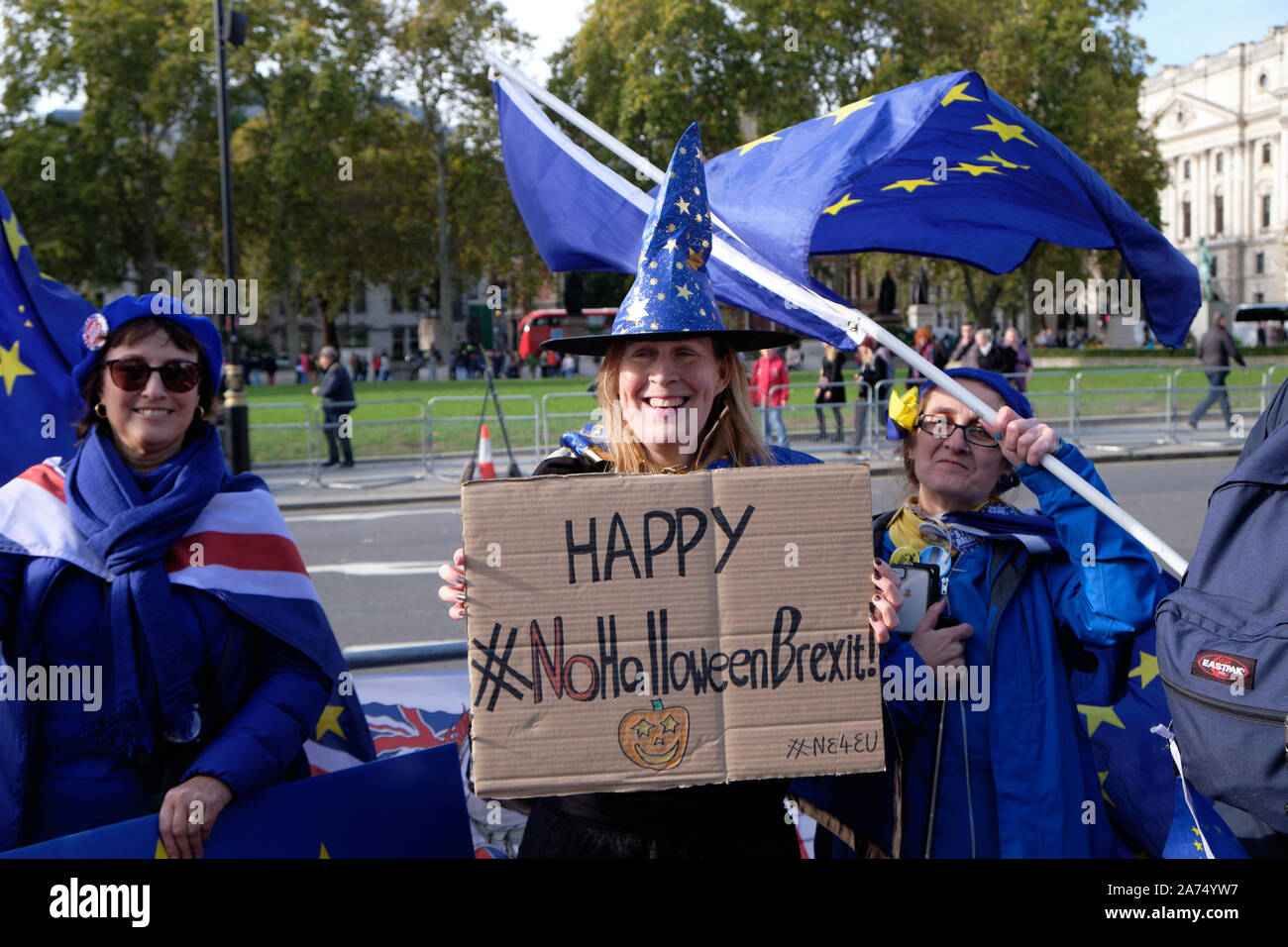 Westminster, England, UK. 30th October 2019.  Remain protesters in front of the House of Commons celebrating another delay in Brexit implementation, highlighting that the imposed deadline of Halloween will go by with the UK still in the European Union, contrarily to promises by the Prime Minister. Woman in  costume highlighting no Halloween Brexit. Credit: JF Pelletier/Alamy Live News. Stock Photo