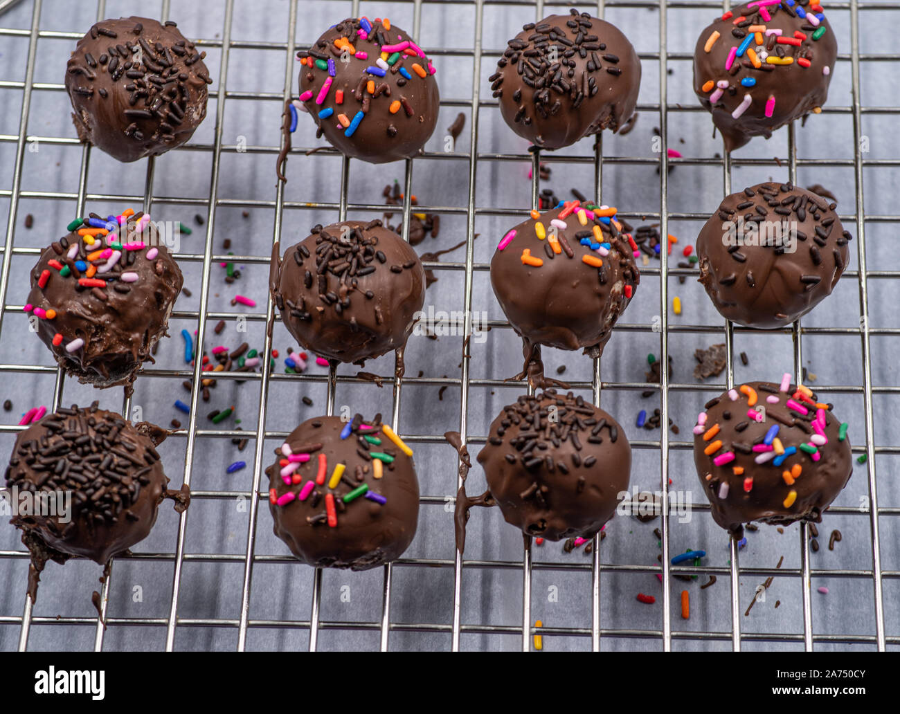 Chocolate donut holes with sprinkles Stock Photo