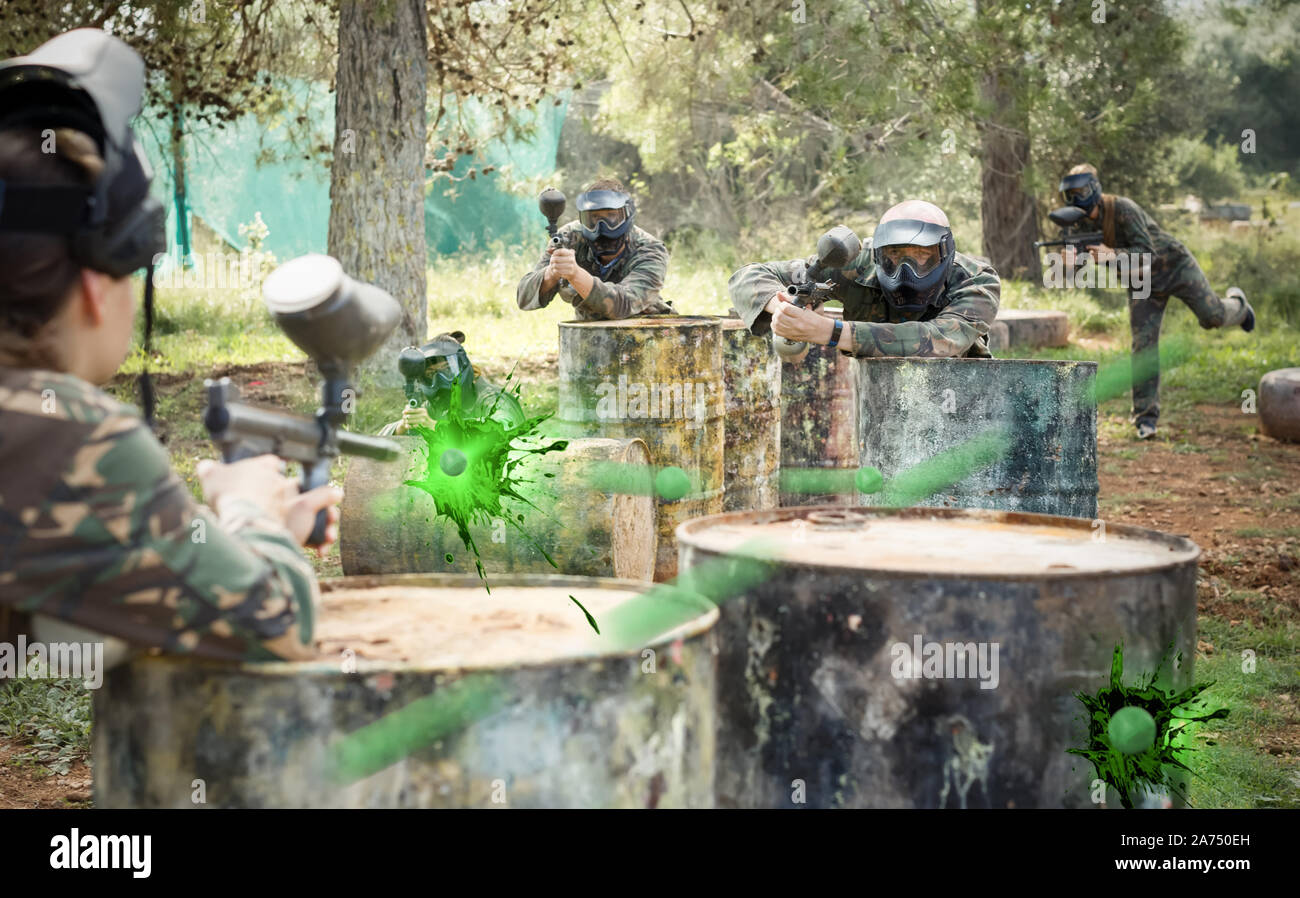 teams facing on battlefield in outdoor paintball arena during the match