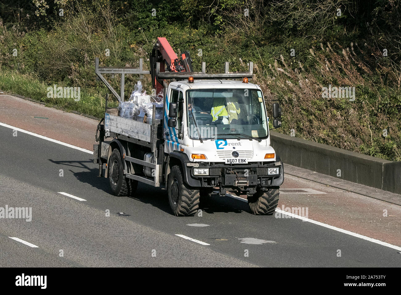 A Mercedes Benz Unimog traveling southbound on ther M6 motorway near Preston in Lancashire, UK Stock Photo
