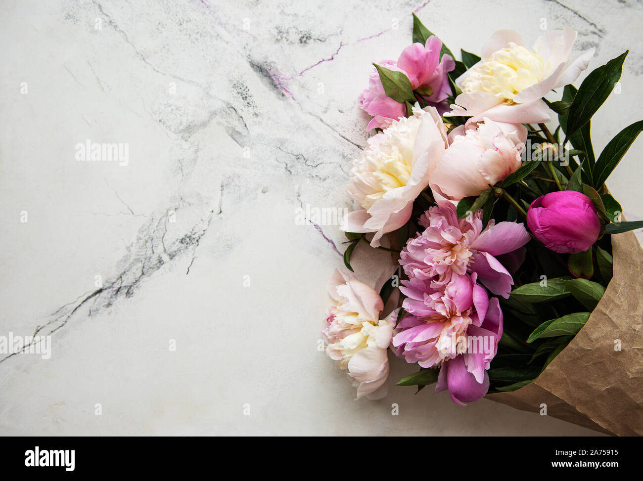 Background with pink peonies on white marble board Stock Photo - Alamy