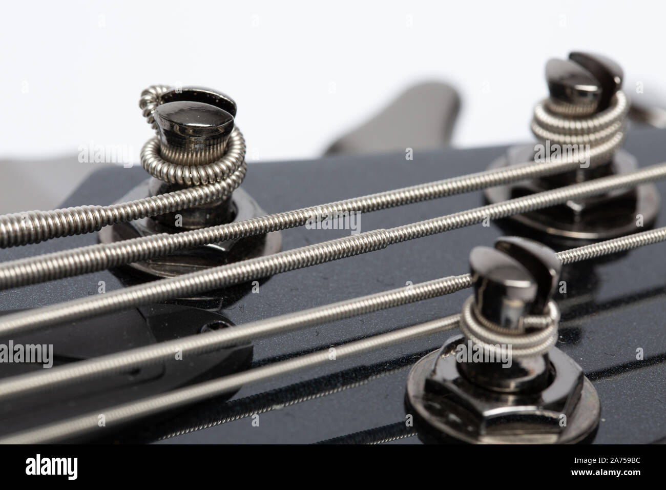 5 String Bass Guitar Tuning Posts Stock Photo - Alamy