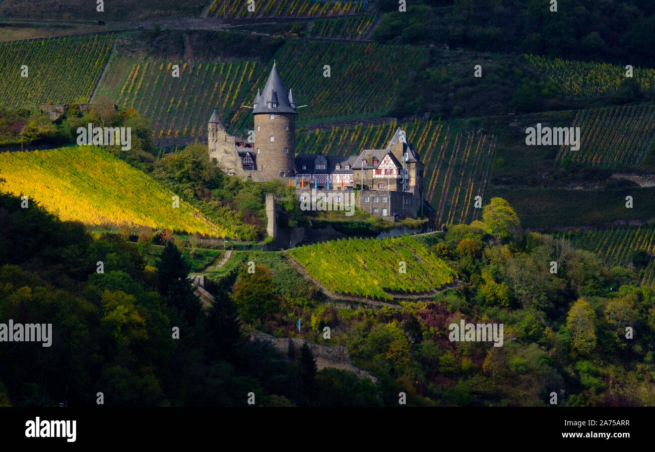 Burg Stahleck castle and town of Bacharach on Rhine in autumn, Rhineland Stock Photo