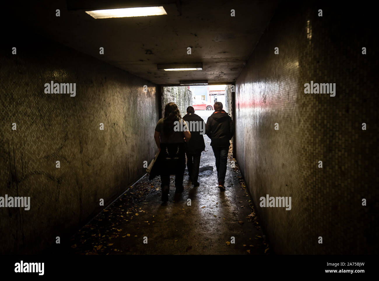 People walk along a underpass in Halifax in Yorkshire, as a think tank says the Conservatives will have to target traditional Labour voters from regional towns in order to win the general election. PA Photo. Picture date: Wednesday October 30, 2019. The Conservatives will have to target traditional Labour voters from regional towns such as Workington in order to win the Christmas general election, according to a think tank. The group urged the party to target towns including Halifax, Warrington, Wigan and Workington in order to gain these key regional seats. Photo credit should read: Danny Law Stock Photo