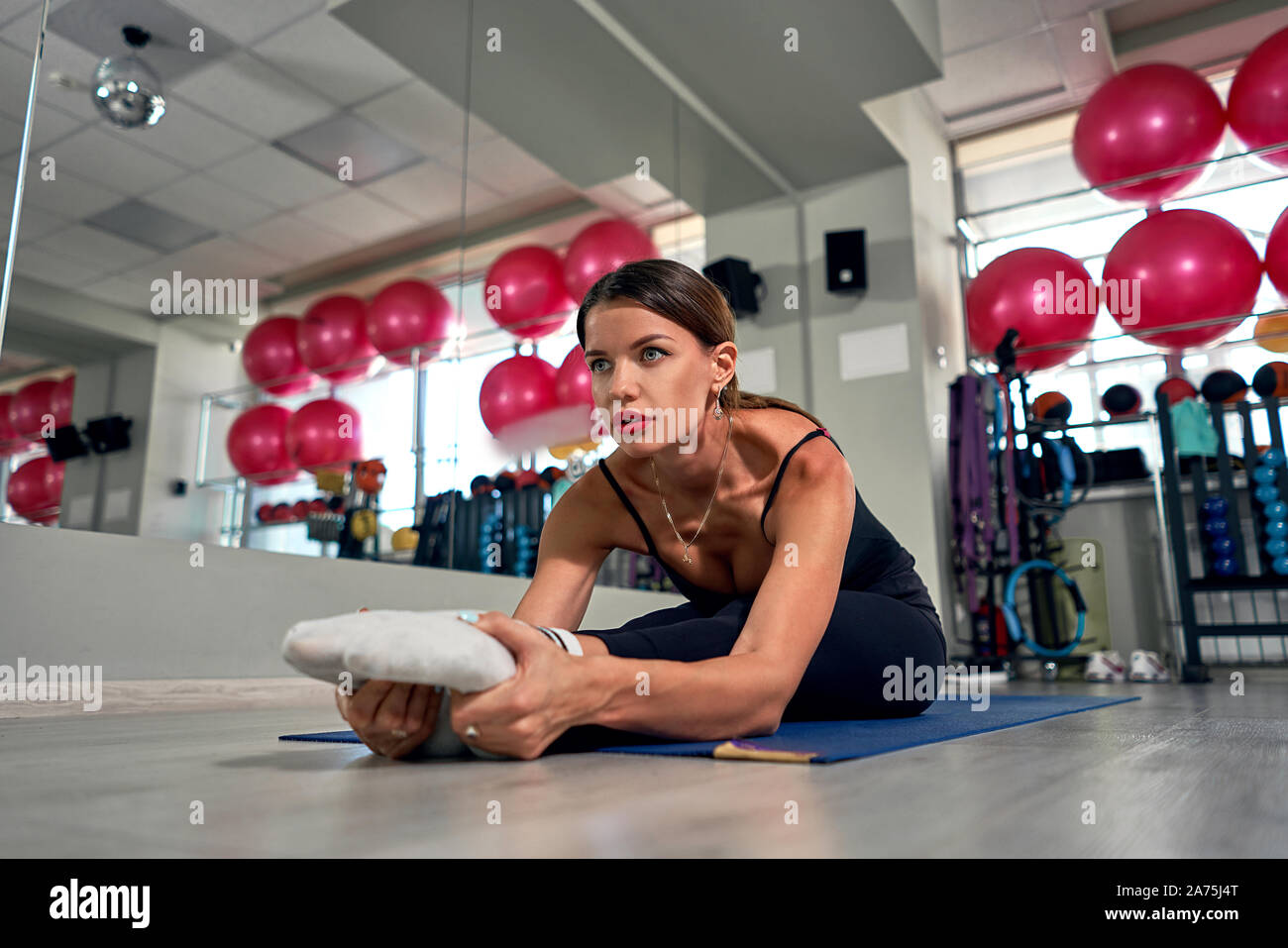 girl doing stretching in the gym Stock Photo